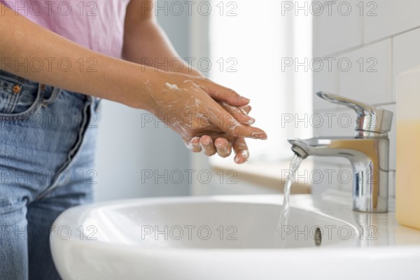 Close up woman washing her hands