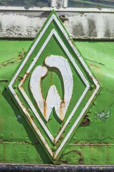 Werder bremen logo on the radiator grill of a vintage car, historic transporter for cooling fish in