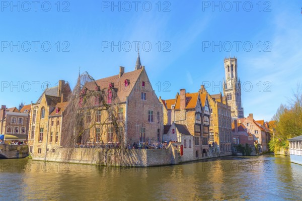Bruges, Belgium iconic cityscape with medieval houses, tower Belfort and Rozenhoedkaai canal