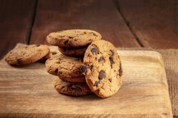 Chocolate chip cookies, gluten free, a close-up of a stack on a dark rustic background