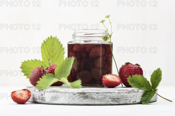 Arrangement with strawberries jar