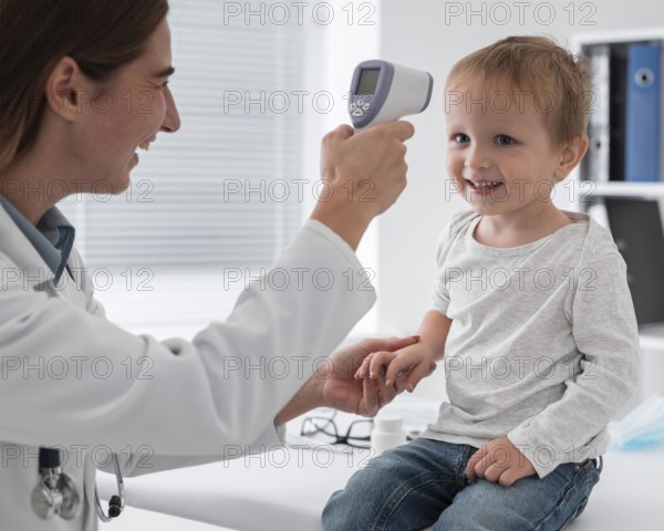 Doctor checking baby s temperature