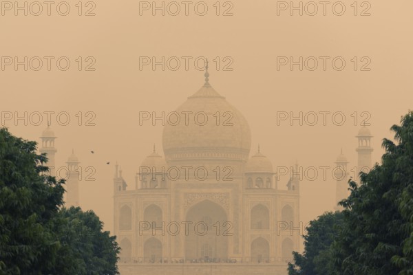 The backside of the Taj Mahal in Agra, India on overcast day with smog