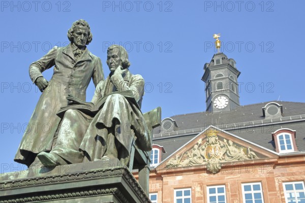 Brothers Grimm national monument, standing Jacob and sitting on the chair Wilhelm and baroque