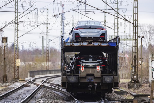 Goods train travelling on the winding Schuster Railway, overhead lines and infrastructure. Car
