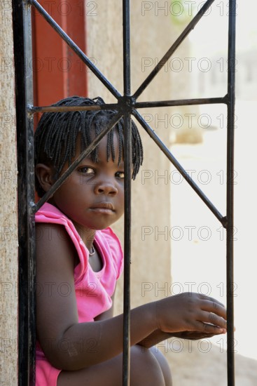 Himba girl in a house in the Himba district of Otuzemba, Otuzemba, Opuwo, Kaokoland, Kunene,