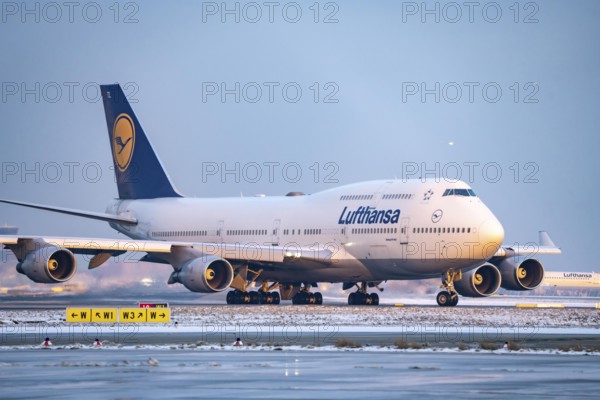 Lufthansa Boeing 747-8, on the taxiway to Runway West, Frankfurt FRA Airport, Fraport, in winter,