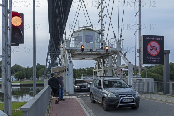 Cars leaving transporter bridge, red traffic light, high bridge, Kiel Canal, Rendsburg,