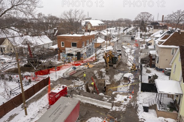 Detroit, Michigan - Workers repair a water main break that flooded streets and homes in southwest