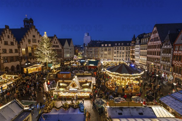 The lights of Frankfurt's Christmas market shine in the evening., Römerberg, Frankfurt am Main,