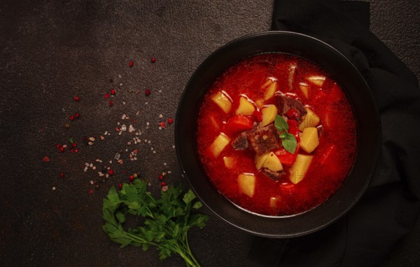 Meat goulash, with potatoes and carrots, sweet pepper, traditional Hungarian soup, homemade, no