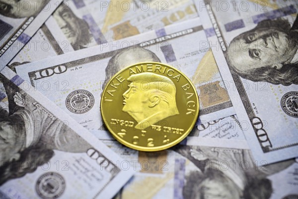 Donald Trump coin as 47th President of the USA on dollar bills, symbolic photo of presidency and US