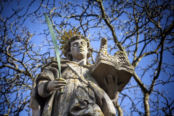 An angel in front of the abbey church St. Stephanus and St. Vitus, Abbey Castle Corvey in Hoexter,