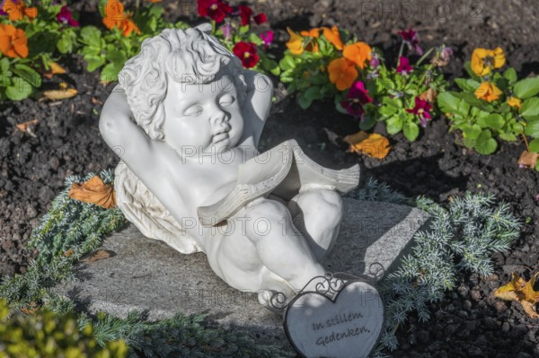 Grave with sleeping cherub near the rococo church of St Ulrich, affectionately known as -the little