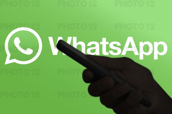 WhatsApp logo is displayed on smartphone.