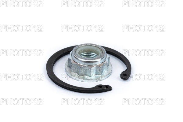 Close-up metal nut with polymer lock and steel locking clip on a white isolated background. Spare