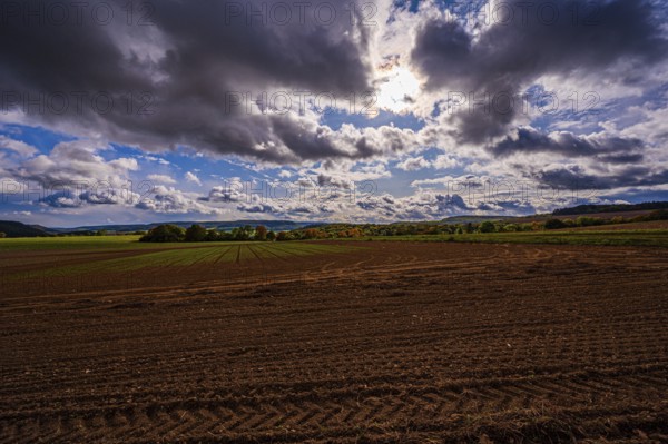 View over the fields of Dornburg towards Jena in autumn with thick rain clouds, Dornburg,