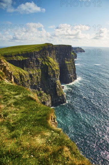 Cliffs of moher in county Clare, Ireland. One of the most popular tourist destinations. Sunny