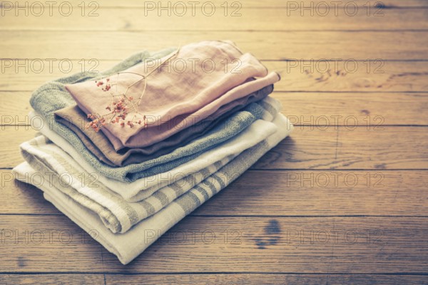 Concept of sustainability - fabric made from natural materials such as cotton and linen on wooden
