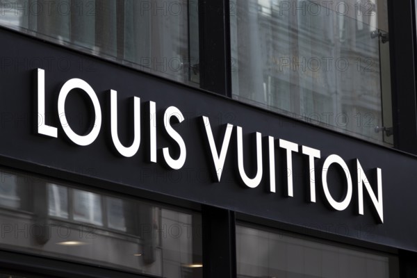 Close-up, logo of the French luxury fashion brand Louis Vuitton on a boutique in the shopping