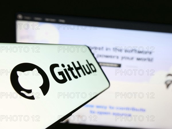 Stuttgart, Germany, 07-09-2023: Cellphone with logo of American software development company GitHub