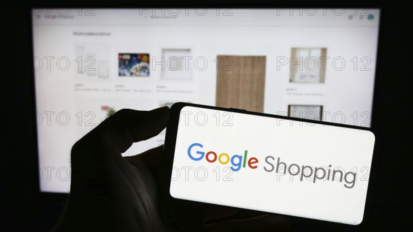Stuttgart, Germany, 09-23-2023: Person holding mobile phone with logo of product search platform