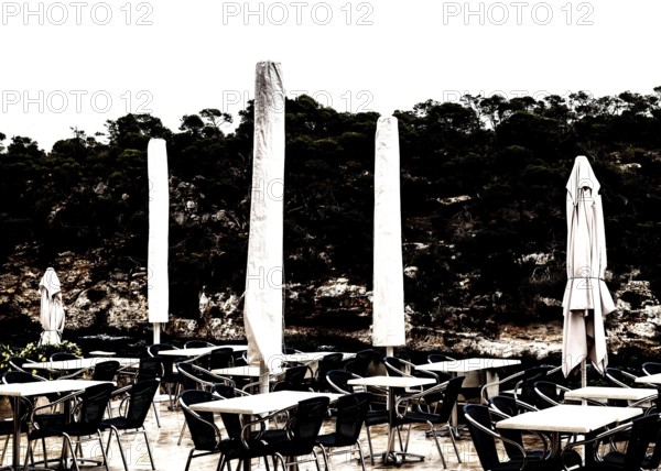 Empty restaurant terrace in the low season in Cala Figuera near Santanyí, Majorca, Balearic