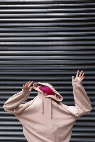 Medium shot teen with pink hoodie