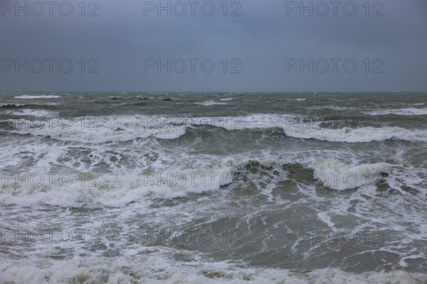Stormy sea, foaming sea in storm with high waves on the English Channel, Portbail, Cotentin,