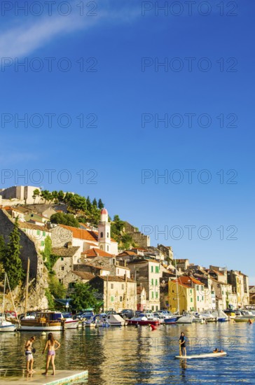 Croatia, 21 07 2014: Old town streets in town Sibenik with marble and stone buildings in background