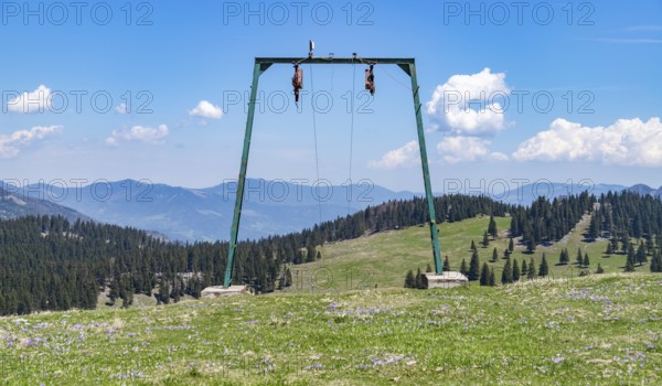 A picture of the landscape of Velika Planina, or Big Pasture Plateau, as seen through a ski lift