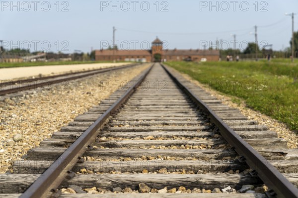 Auschwitz, Poland - 15 September, 2021: selective focus low angle view of the railroad tracks