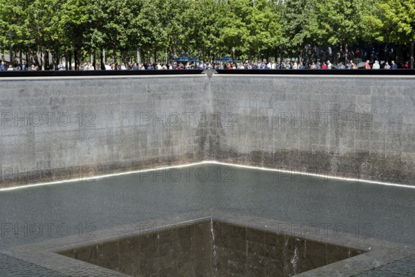 New York, United States of America, September 19, 2019: People standing at the north pool of the
