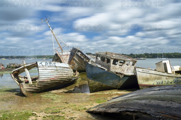 Pin Mill, England - 11 June, 2022: view of the boat graveyard at Pin Mill on the River Orwell in