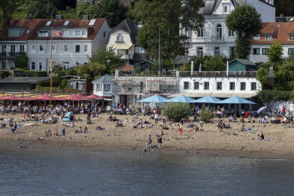 Symbolic picture weather, summer, people bathing in the Elbe in front of the restaurants