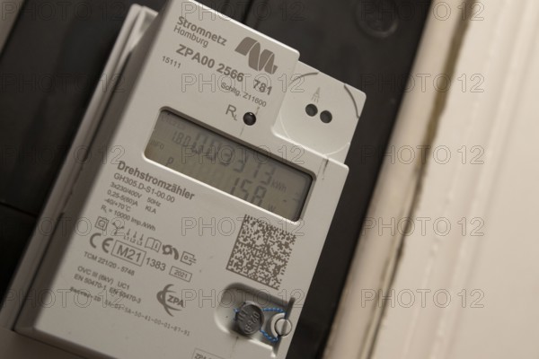 Symbolic image of energy costs in the household, digital electricity meter in a flat, operator
