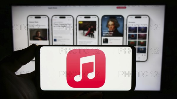 Stuttgart, Germany, 09-23-2023: Person holding smartphone with logo of streaming service platform