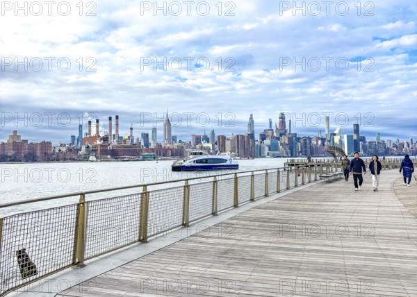 Domino Park waterfront promenade, Williamsburg, with a view across the East River to the Manhattan