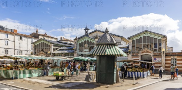 Market stalls in front of the historic market hall in the old town, La Rochelle, Atlantic coast,