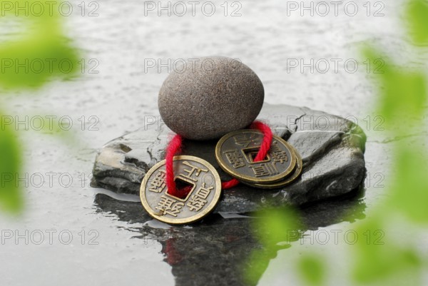 Stones and Chinese lucky coins, coins, lucky coins, lucky coin, coin, in water