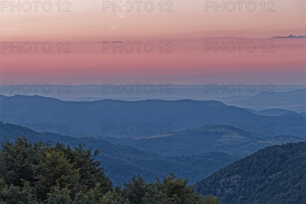 Dawn over the mountain landscape of the Balkan Mountains and the wooded slopes of the Balgarka