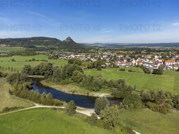 The Radolfzeller Aach with the village of Hausen an der Aach, on the horizon the Hegau volcano