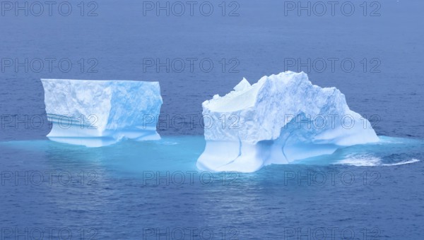 Iceberg seen from cruise ship vacation near Greenland coast in Arctic circle near Ilulissat Disko