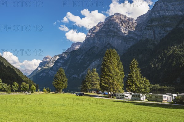 Vorauen campsite on the shores of Lake Klöntal with the Glärnisch Group rising up to 2915 metres,