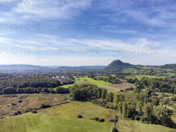 View over the Hausener Aachried to the Hegau volcano Hohentwiel with the town of Singen, Constance