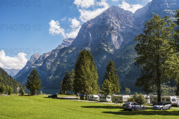 Vorauen campsite on the shores of Lake Klöntal with the Glärnisch Group rising up to 2915 metres,