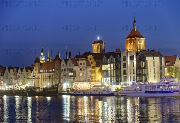 The harbour district on the Motlawa river, Motlawa, in the city centre of Gdansk, illuminated in