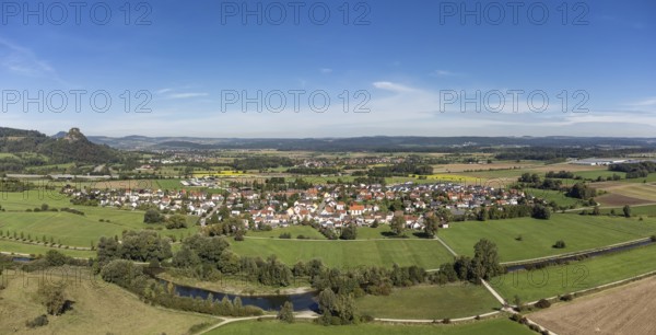 The Radolfzeller Aach with the village of Hausen an der Aach, on the horizon the Hegau volcano