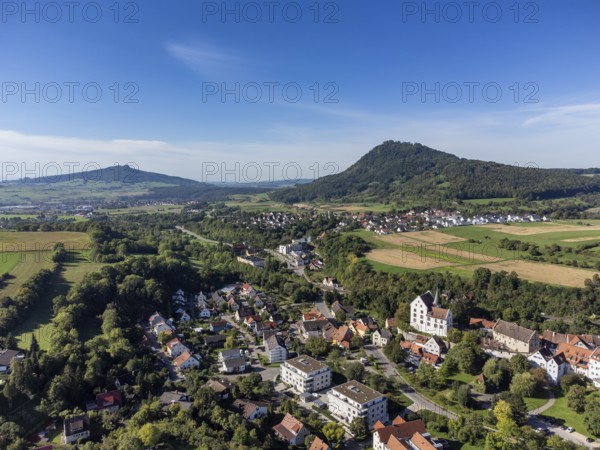 Aerial view of the town of Engen, on the right the Hegau volcano Hohenhewen. on the left the