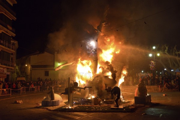 A burning Falla, a papier-mâché figure, at the Falles or Fallas spring festival, Pego, Province of